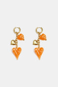 Earrings with dangling hearts on a chain