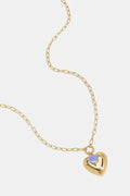 Necklace with heart pendant and bead on a ring