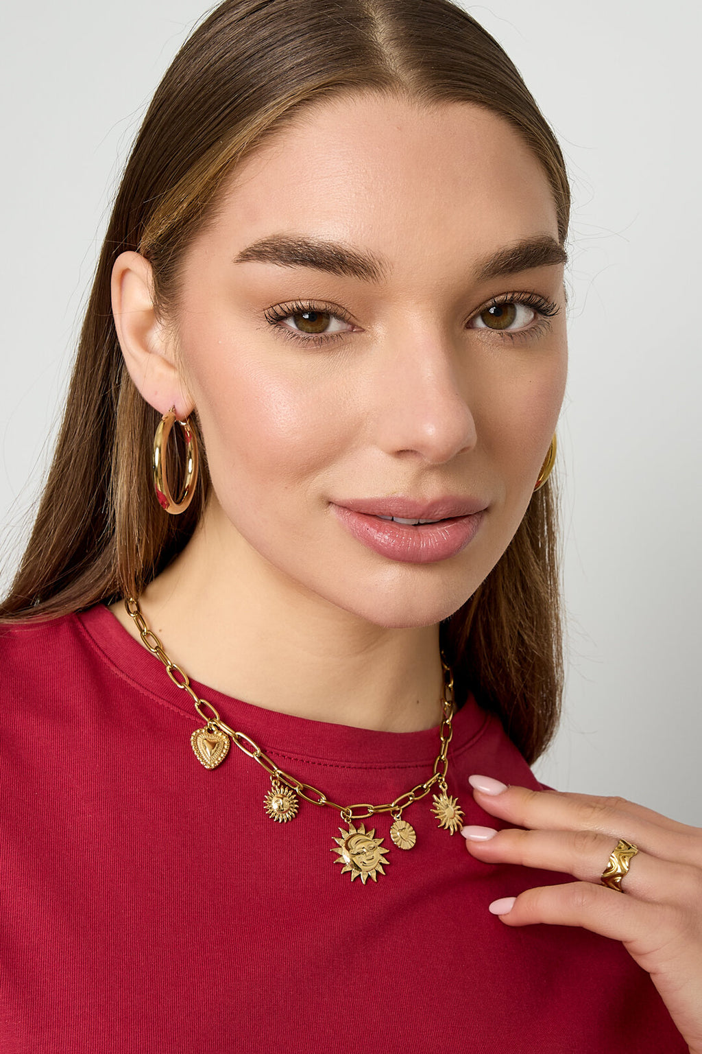 Necklace with sun and heart charms